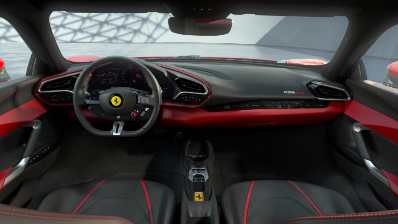 The black interior and red accents of the inside of a Ferrari