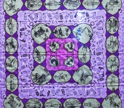 A purple scarf with green prints.