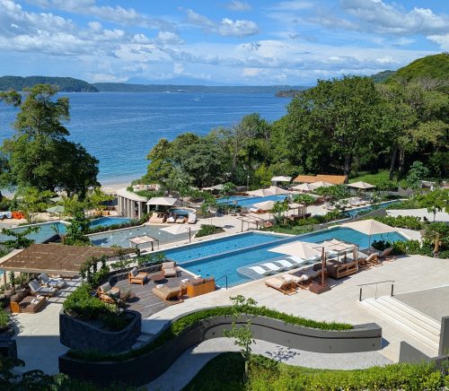 A pool overlooking the ocean.