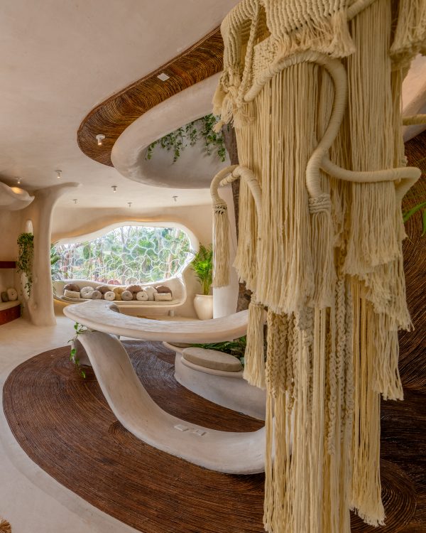 Lobby interior with textile art and modern furniture.