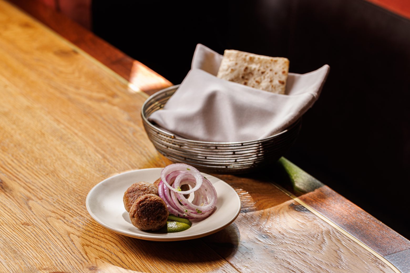 A dish with a side of bread.